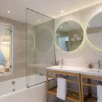 Combined shower/tub, eco-friendly toiletries, hair dryer, slippers