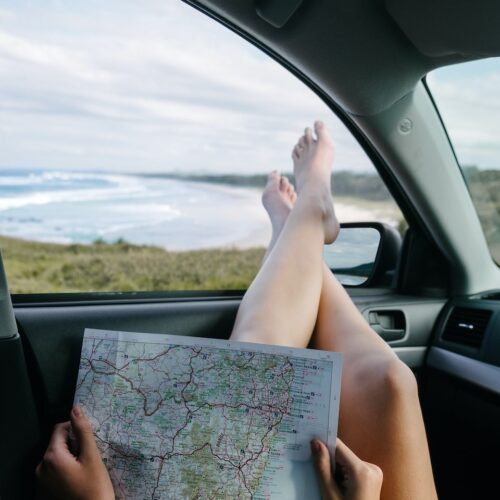 woman holding map, Car Rental Companies in the Dominican Republic with Average Prices