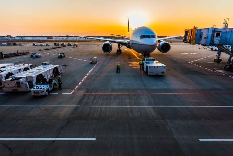 gray airplane on parking flights