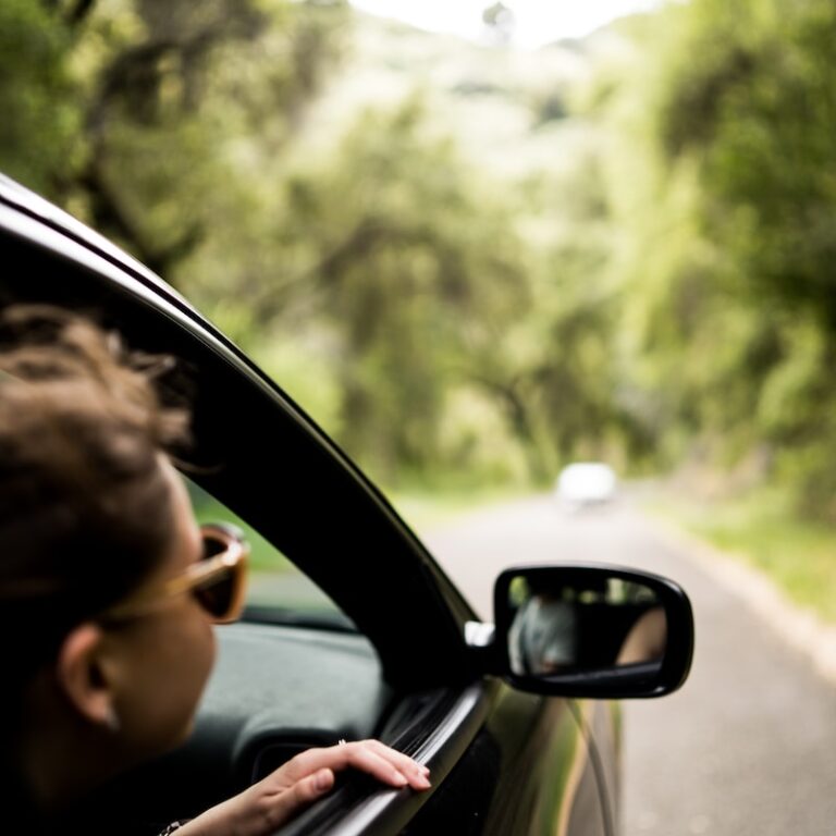 woman sitting inside vehicle