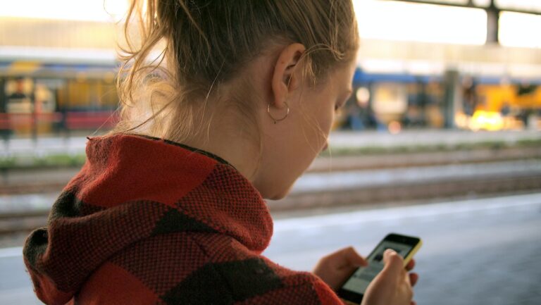 woman holding phone, phone area code